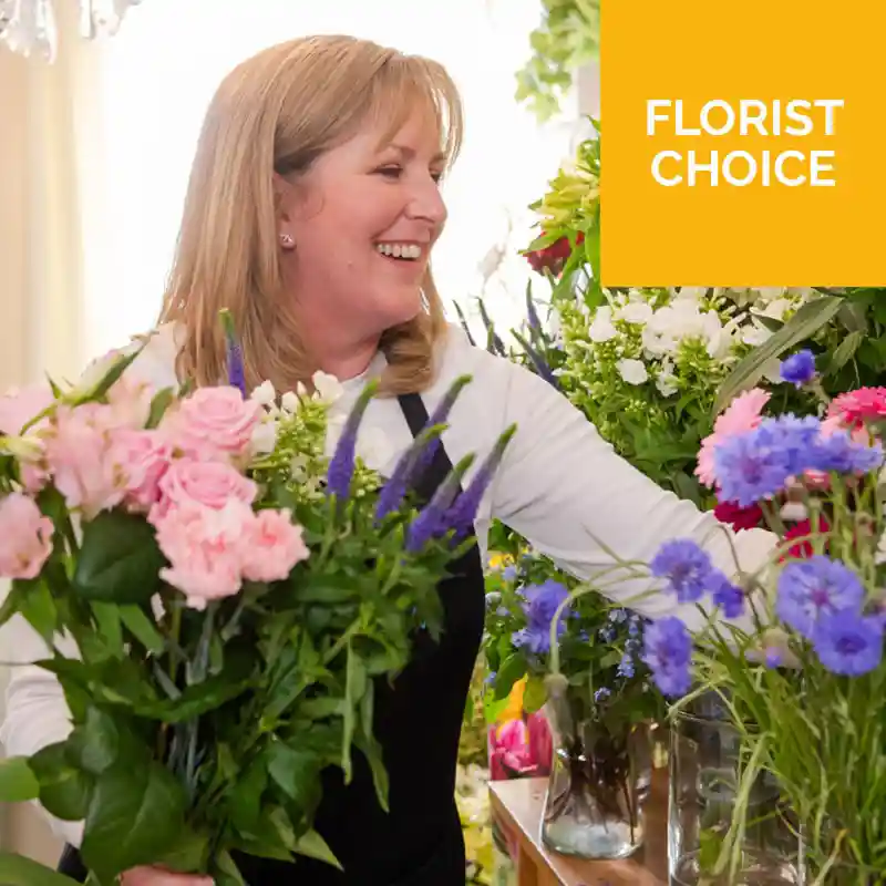 A beautiful Mother's Day Florist Choice bouquet featuring a hand-selected mix of fresh seasonal flowers in vibrant colors, expertly arranged by a skilled florist. Perfect for a heartfelt and unique gift, with delivery available across London.